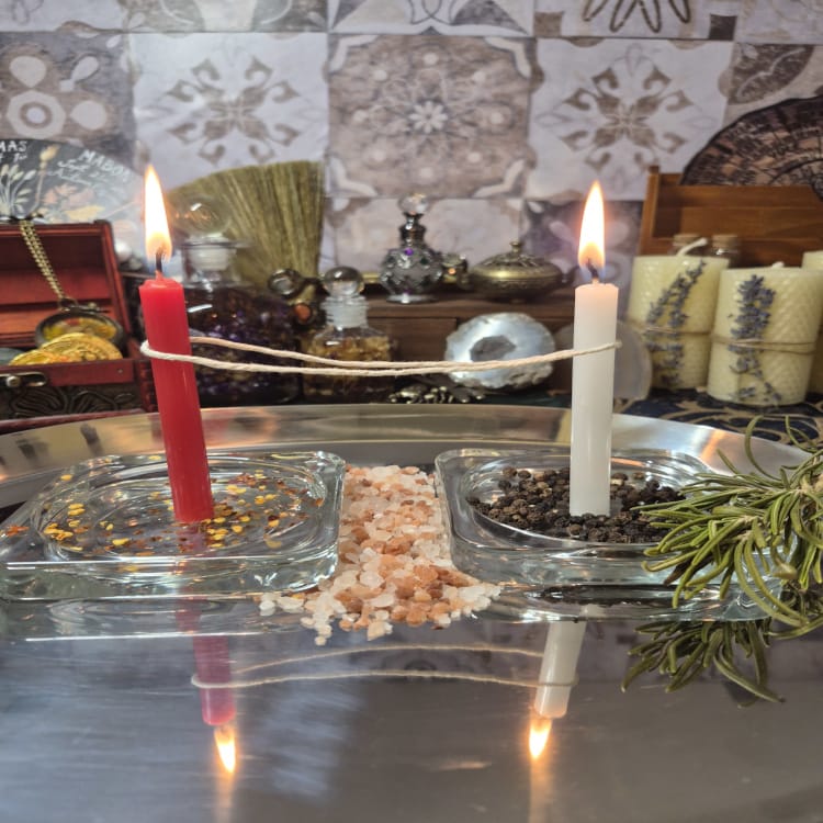 Cord cutting ritual with red and white candles for emotional release